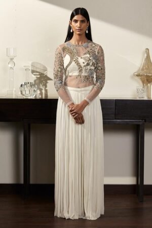 Ivory pleated skirt, embroidered top